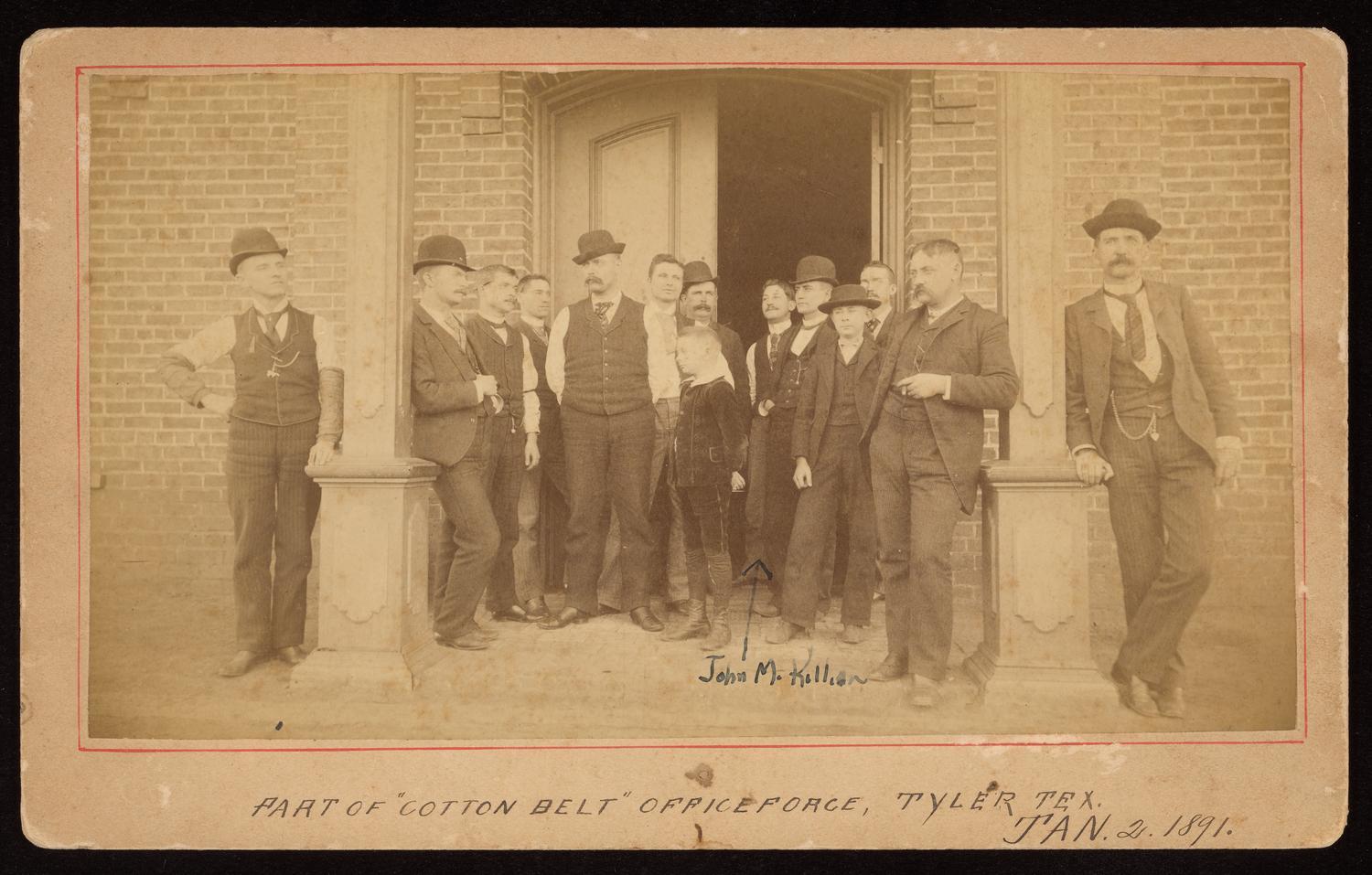 Cotton Belt Office Force, Tyler, Texas — January 2, 1891. Men and boys in bowler hats and dark suits in front of the Cotton Belt office.